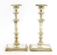 Lot 250 - A pair of George II silver candlesticks