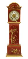 Lot 372 - A miniature porcelain longcase clock
