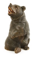 Lot 510 - A carved soft wood Black Forest bear