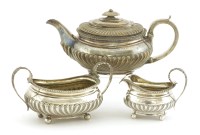 Lot 302 - A silver three-piece tea set