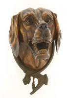 Lot 509 - A carved wooden dog's head wall mask