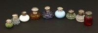 Lot 21 - Nine small glass bottles with plated and silver mounts