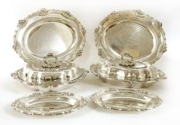 Lot 317 - A suite of silver serving dishes and plates