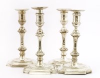 Lot 318 - A set of four silver candlesticks