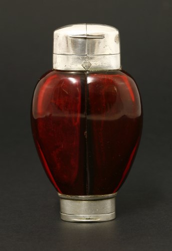 Lot 78 - An unusual Victorian cranberry glass double scent bottle and vinaigrette