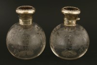 Lot 207 - A pair of glass cologne bottles with silver and tortoiseshell covers