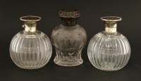 Lot 209 - A pair of glass cologne bottles with silver and tortoiseshell hinged covers