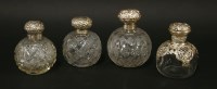 Lot 210 - Two cut-glass silver cologne bottles