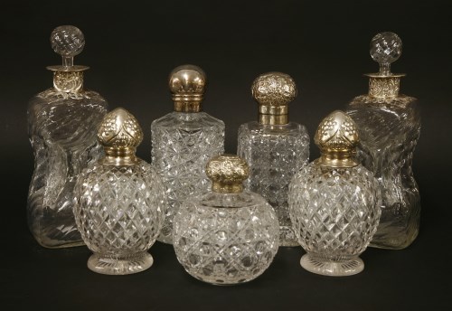 Lot 147 - A pair of moulded glass and silver-mounted decanters and stoppers