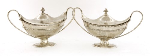 Lot 150 - A good pair of George III silver two-handled sauce tureens and covers