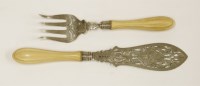 Lot 181 - A pair of Victorian silver and carved ivory-handled fish servers
