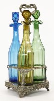 Lot 324 - A silver-plated triple bottle coaster