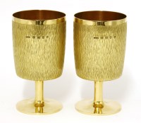 Lot 228 - A pair of 18ct gold goblets