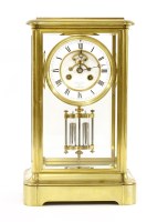 Lot 884 - A French brass regulator mantel clock