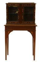 Lot 639 - An Edwardian inlaid two door display cabinet