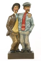 Lot 203 - A group of two carved wooden whistling men