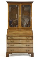 Lot 561 - A late George III mahogany bureau bookcase