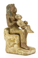 Lot 177 - An Egyptian carved palmwood group of (possibly?) Isis holding Osiris