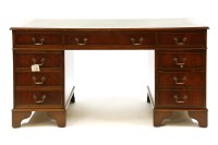 Lot 643 - A reproduction mahogany twin pedestal desk