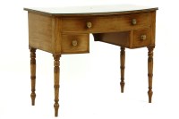 Lot 550 - A Regency mahogany bow front dressing table