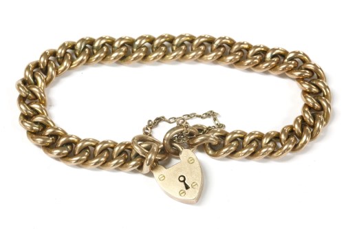 Lot 29 - A 9ct gold hollow curb link bracelet with padlock