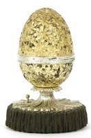 Lot 147 - A silver parcel gilt musical novelty egg
