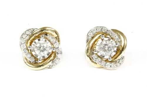 Lot 16 - A pair of gold single stone diamond stud earrings