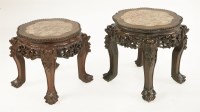 Lot 635 - Two Chinese hardwood vase stands