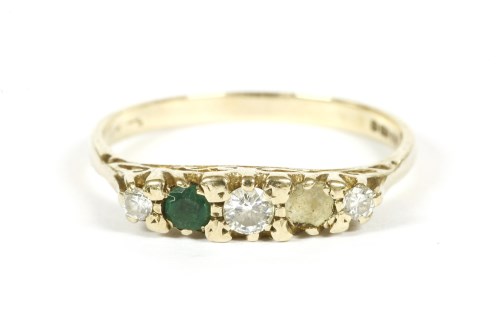 Lot 8 - A 9ct gold five stone graduated diamond and emerald ring boat shaped ring