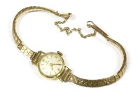 Lot 5 - A ladies 18ct gold Tissot mechanical strap watch