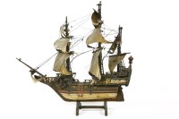Lot 380 - A wooden three mast ship on stand