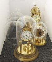 Lot 312 - Four brass 40 day clocks