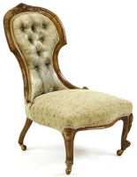 Lot 582 - A Victorian walnut overstuffed seat nursing chair