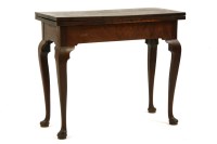 Lot 645 - A George II mahogany fold over top tea table