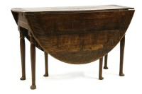 Lot 509 - A large oak 18th century table standing on pad feet