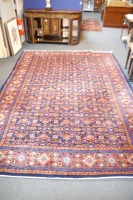 Lot 667 - A multiple banded blue and red border rug