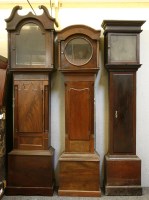 Lot 647 - Three mahogany longcase clock cases