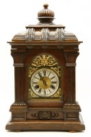Lot 387 - A Continental walnut mantle clock