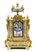 Lot 381 - A gilt metal and porcelain mounted mantel clock