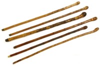 Lot 420 - A quantity of Japanese carved bamboo walking sticks