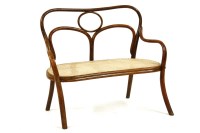 Lot 633 - A child's Bentwood settee with caned seat