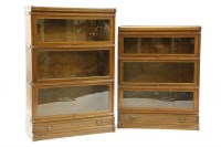 Lot 649 - Two oak globe Wernicke book cases