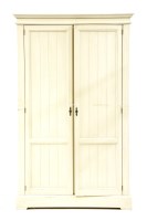 Lot 622 - A painted pine double wardrobe