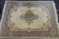 Lot 661 - An Indian ivory ground carpet