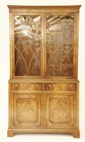 Lot 651 - A George III style mahogany bookcase cabinet