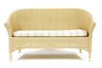 Lot 587 - A Lloyd loom pale yellow settee