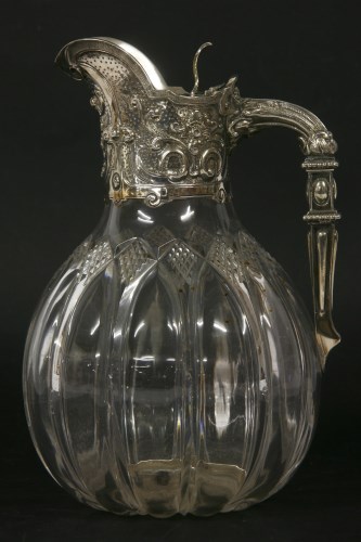 Lot 94 - A silver mounted glass and claret jug