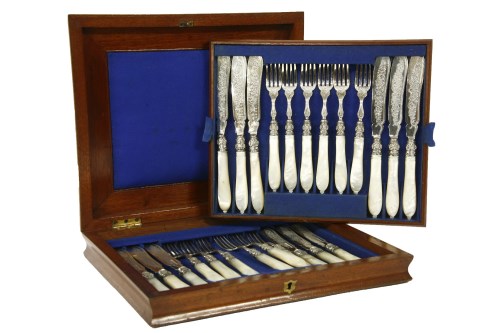 Lot 88 - A cased set of twelve pairs of Victorian silver dessert knives and forks