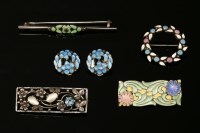 Lot 691 - A collection of four brooches and a pair of earrings attributed to Bernard Instone