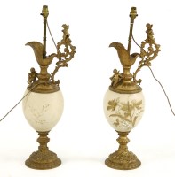 Lot 291A - A pair of large Victorian gilt metal and opaline glass table lamps